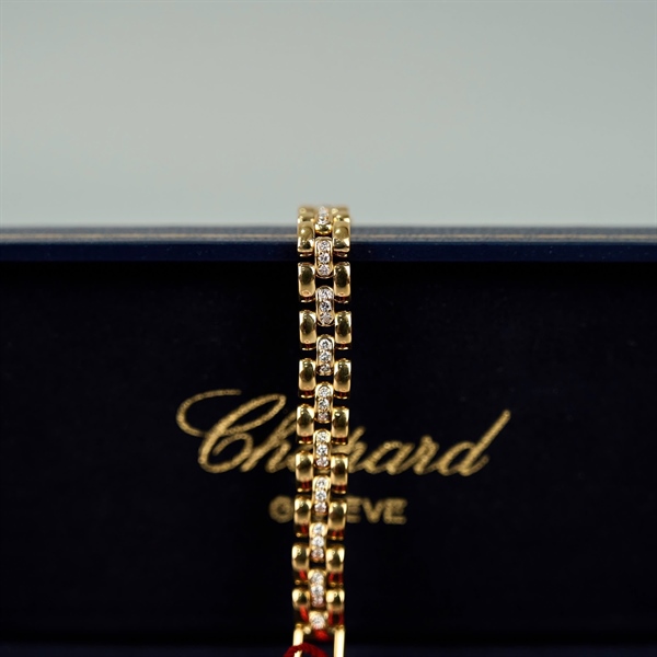 Đồng hồ Chopard mặt tròn vàng đính đá (426721) (HC) +