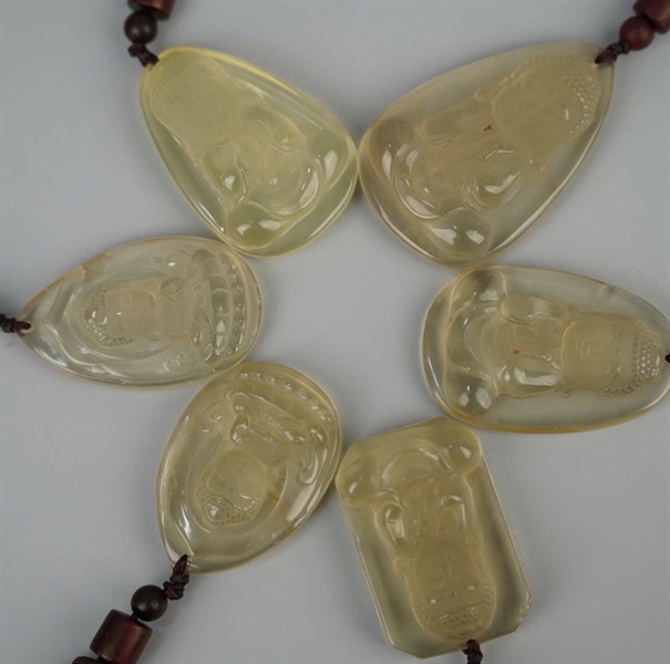 Mặt dây phật thạch anh vàng +