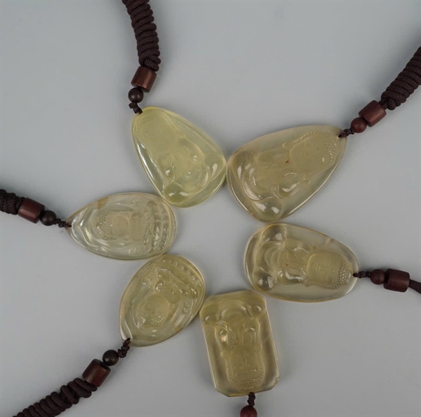 Mặt dây phật thạch anh vàng +