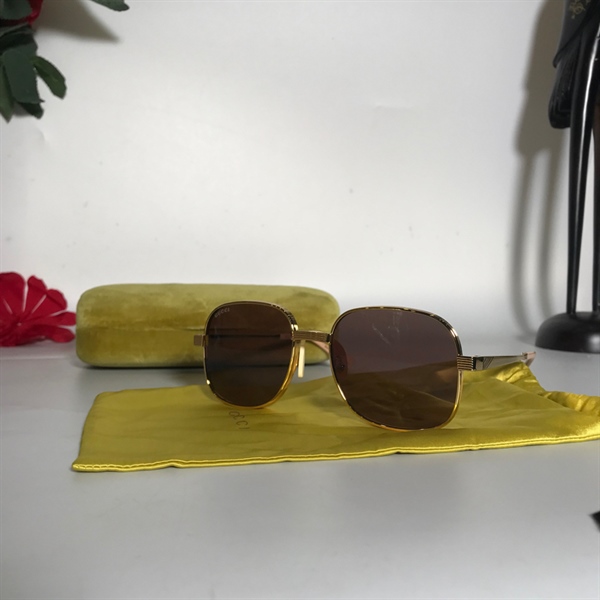 Kính Gucci vàng KG+