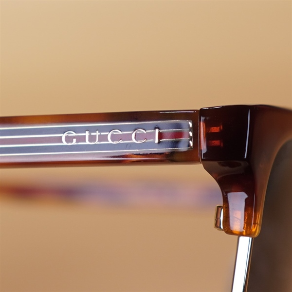 Kính đen GG gọng nâu đỏ KG+